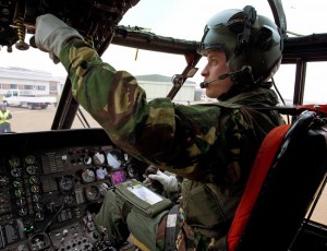 Britain's Prince William sits at the controls of a Sea King helicopter during a training exercise in Wales